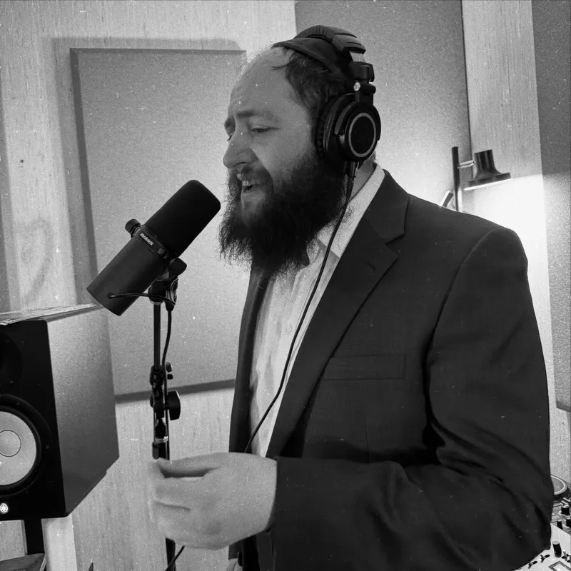 Motty recording vocals in black and white